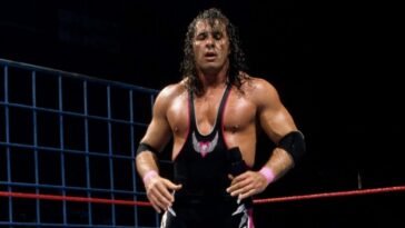 Bret Hart looks moody inside a steel cage