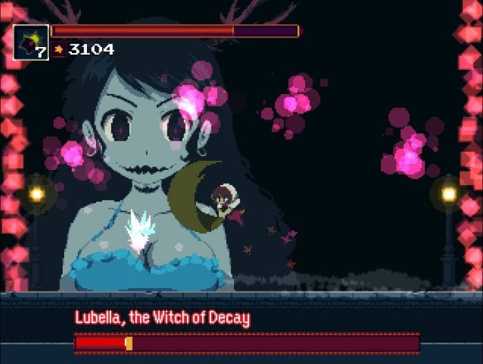 Kaho fights Lubella, Witch of Decay, a large blue woman with a mouth like a Jack- o- Lantern's