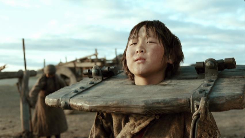 A young Temudjin, locked in stocks