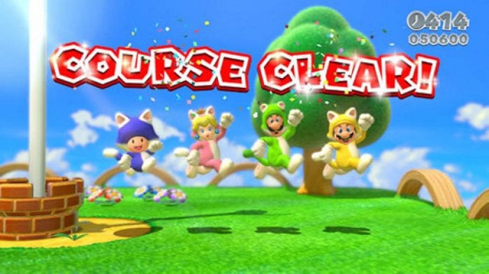 the four main characters in cat suits at the end of a level, with "course complete" shown above them