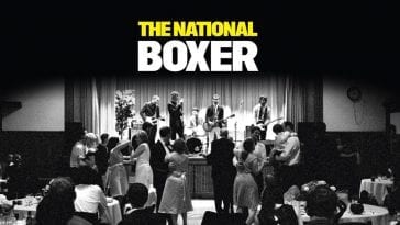 Cover image of The National's Boxer, depicting the band playing a concert at a wedding in black and white