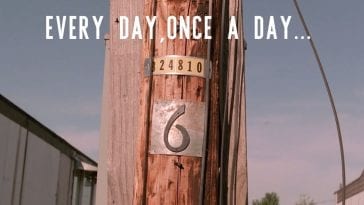 a telephone pole with the number 6