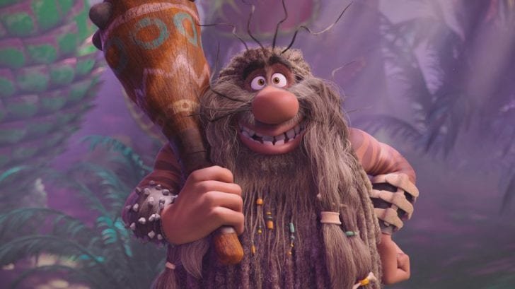 Captain Caveman holds his club with a smile.