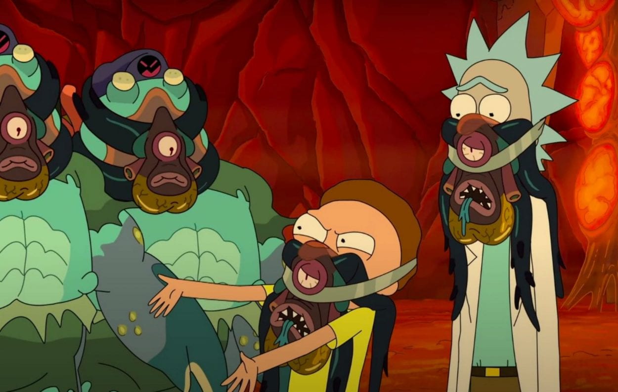 An angry Morty, dead facehugger strapped to his mouth, confronts the Glorzos.