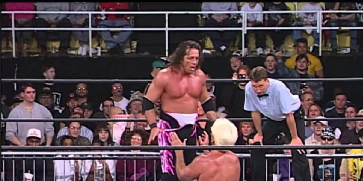 Bret Hart bears down on a cowering Ric Flair at WCW Souled Out 1998