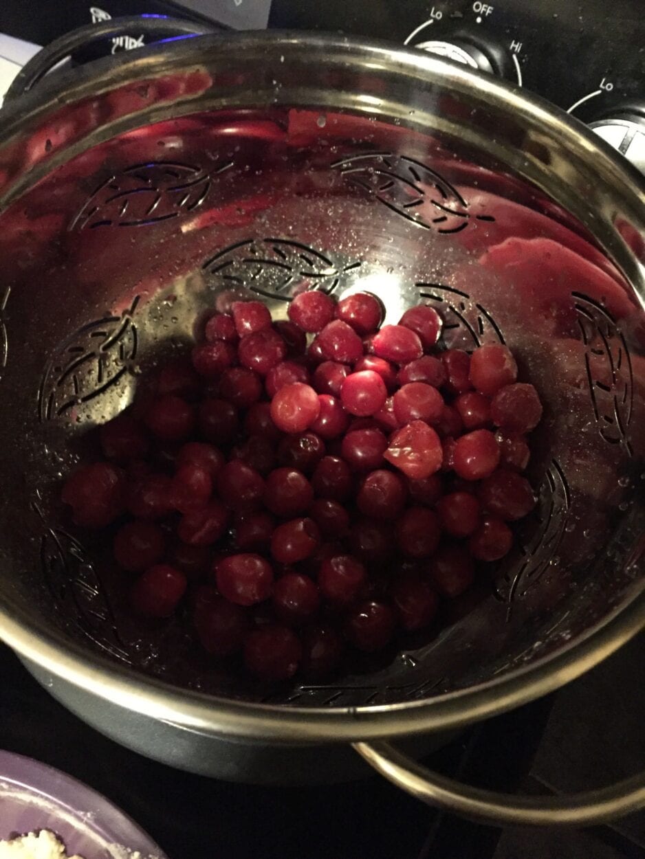 Red Tart cherries in a metal bowl