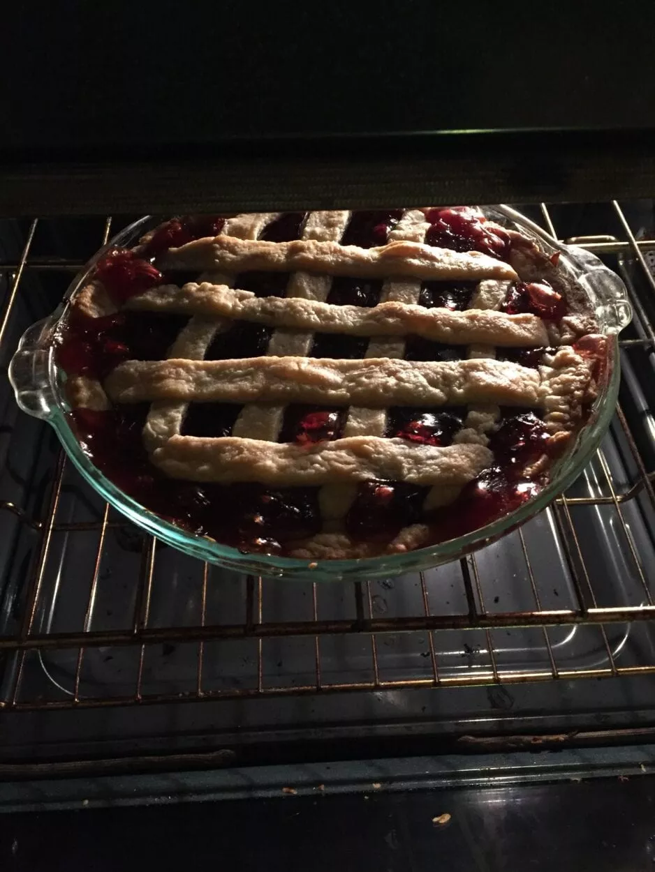 The pie is cooked and sitting in the oven, looking great!