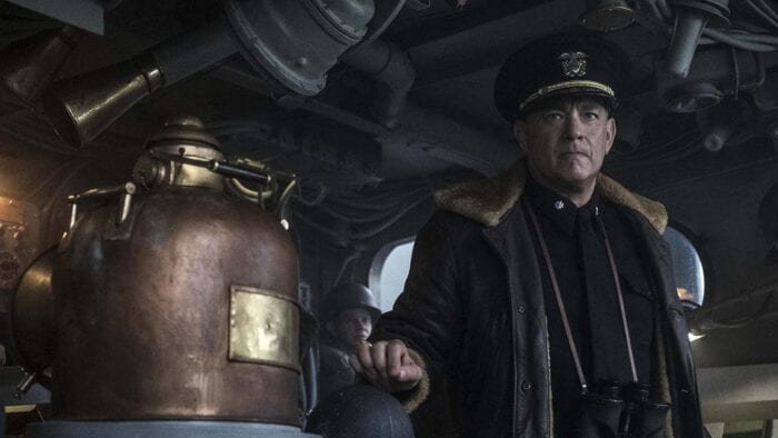 Captain Ernest Krause stands ready at the helm in his sheepskin jacket.