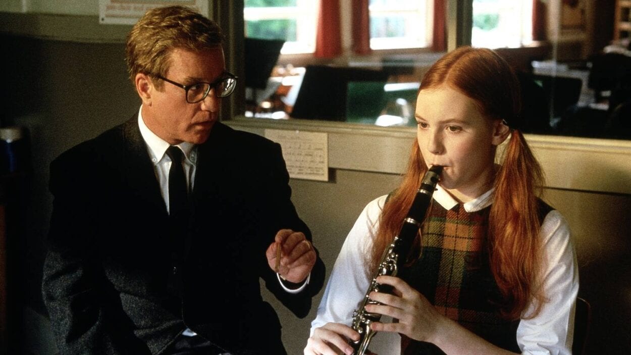 Glenn Holland advises a clarinet student through her practice.