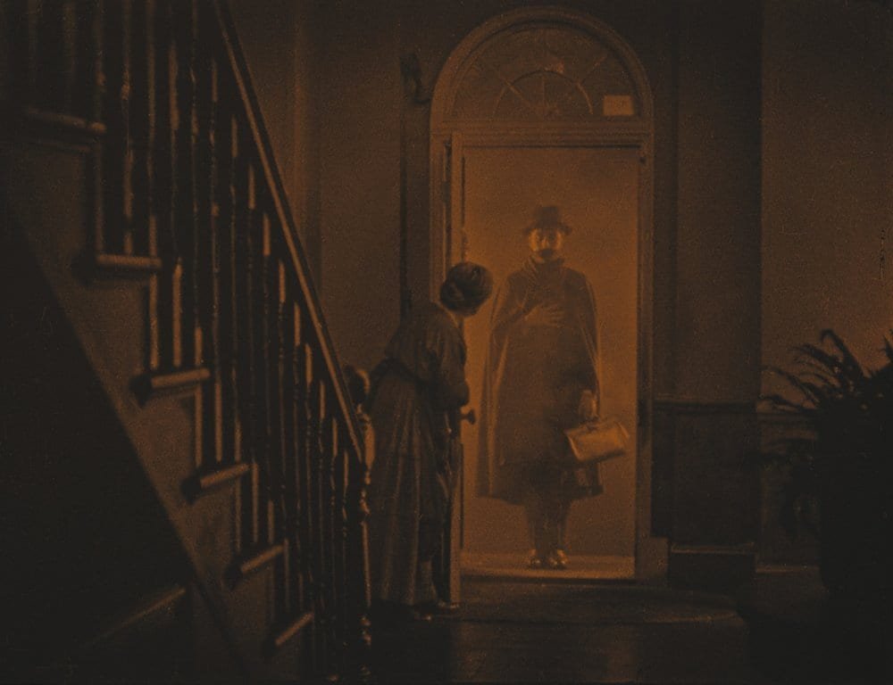The lodger stands in the doorway