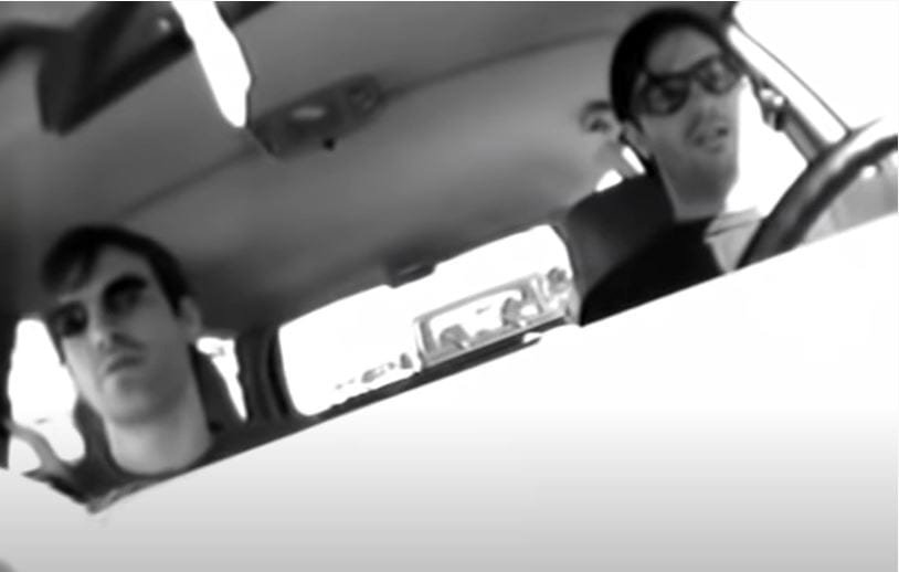 Courtney Taylor and Anton Newcombe sit in a car together