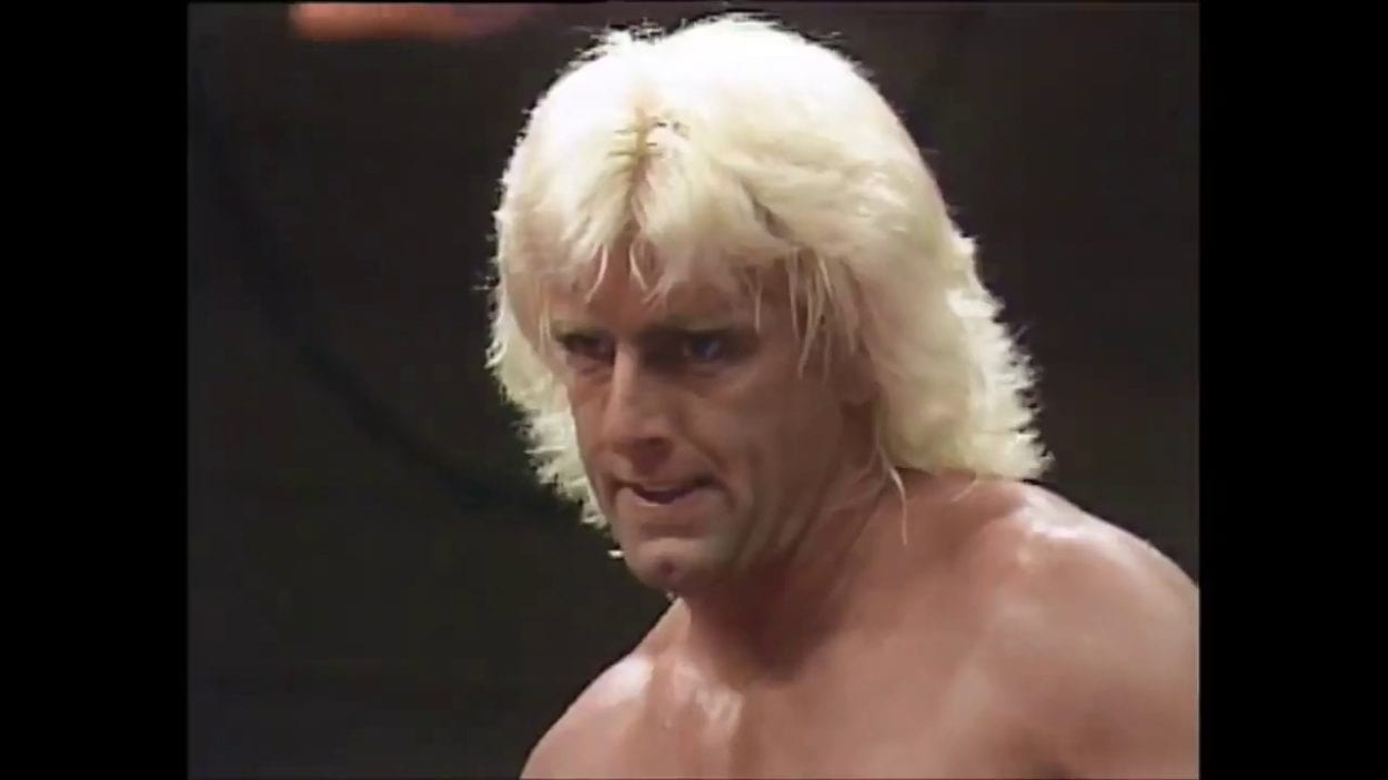 Ric Flair stares intently, ready for action