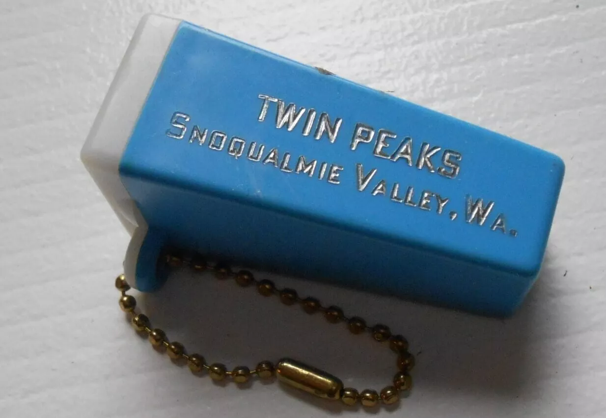 blue single slide rectangular viewer the size of a keychain, embossed with "Twin Peaks Snoqualmie Valley, Wa" in gold.