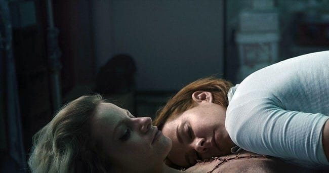 Ruby lying over a corpse at her place of day work, the mortuary