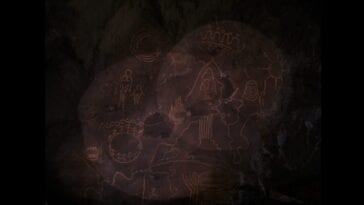 Two flashlights focus on the map in the Owl Cave