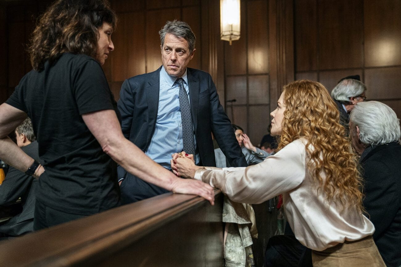 Grace leans towards Jonathan in the courtroom