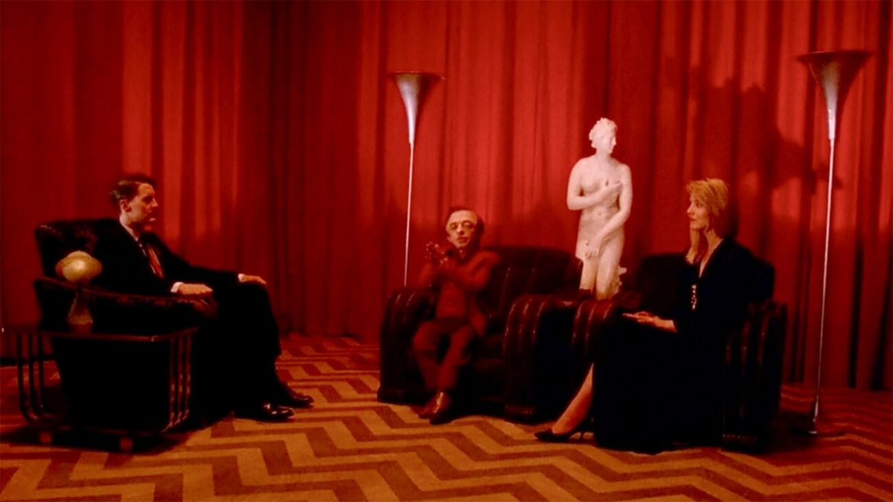 Cooper sits in the Red Room for the first time, accompanied on his left by The Little Man and Laura Palmer, sitting on a couch
