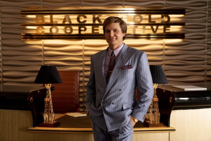Maxwell Lord smiles at his office reception area.