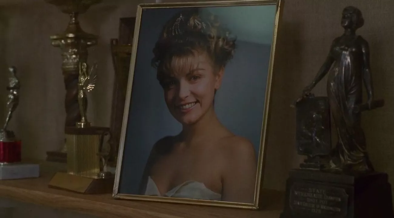Laura Palmer's homecoming photo on display among trophies. 