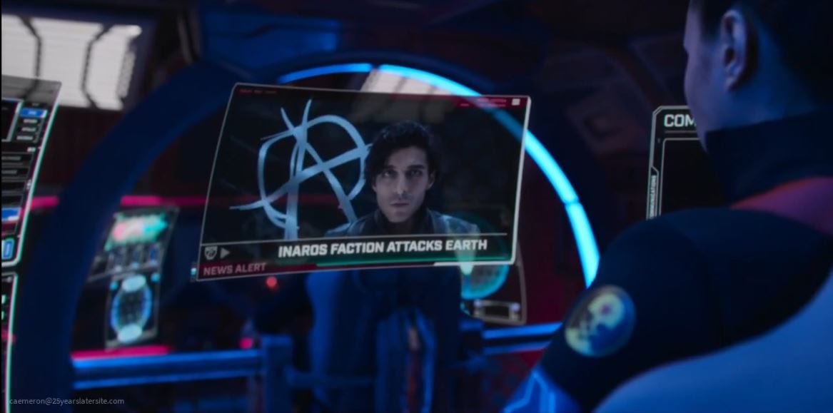 Marco speaks on TV taking responsibility with an anarchy sign flag behind him in The Expanse S5E4