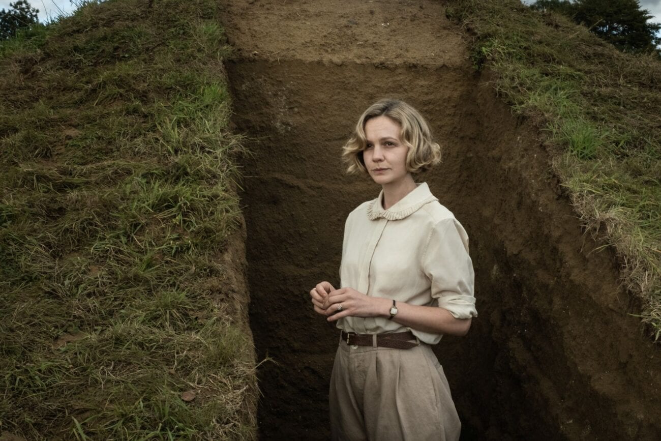 Mrs. Pretty stands within the partially excavated mound.