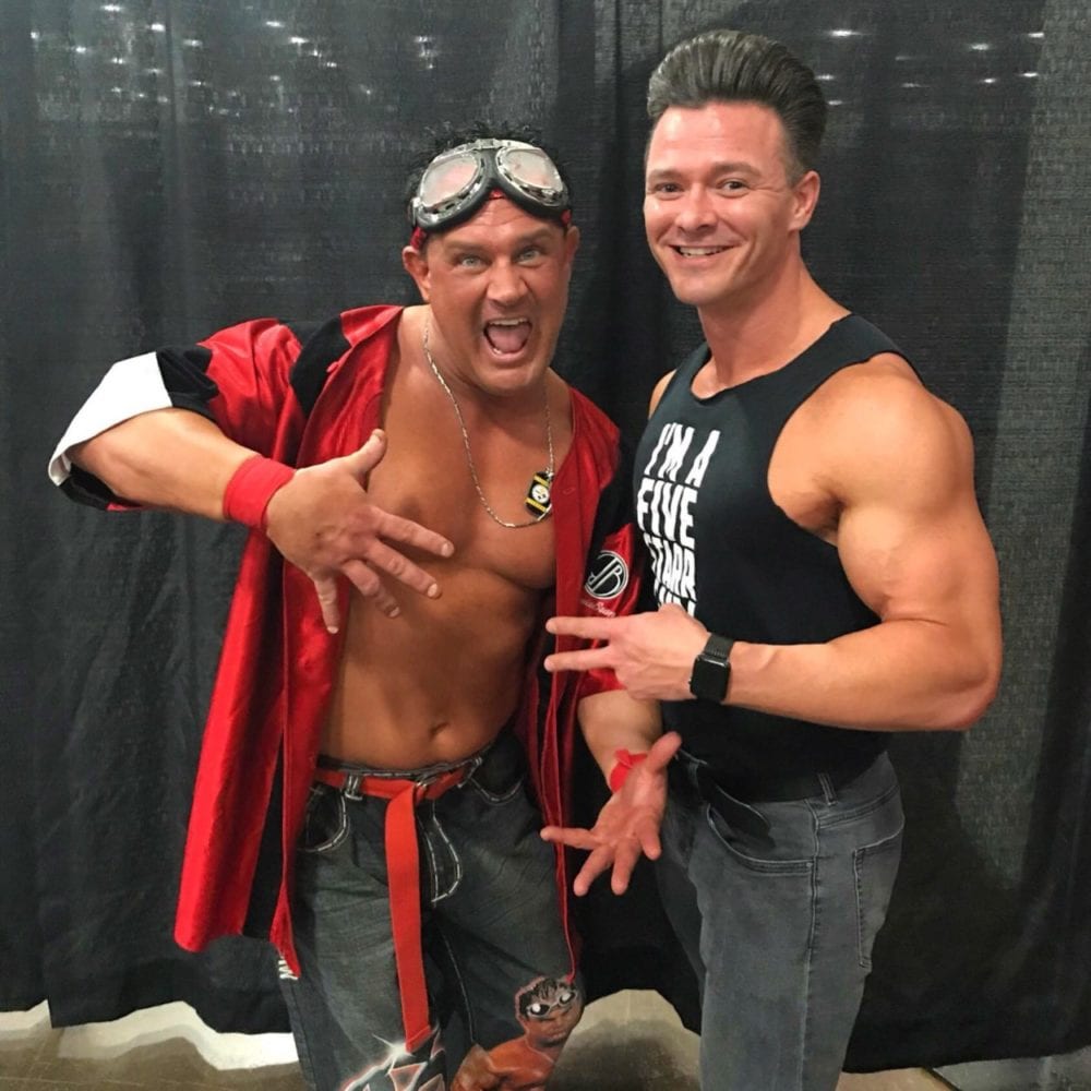 Brian Christopher and Dustin Starr pose together backstage