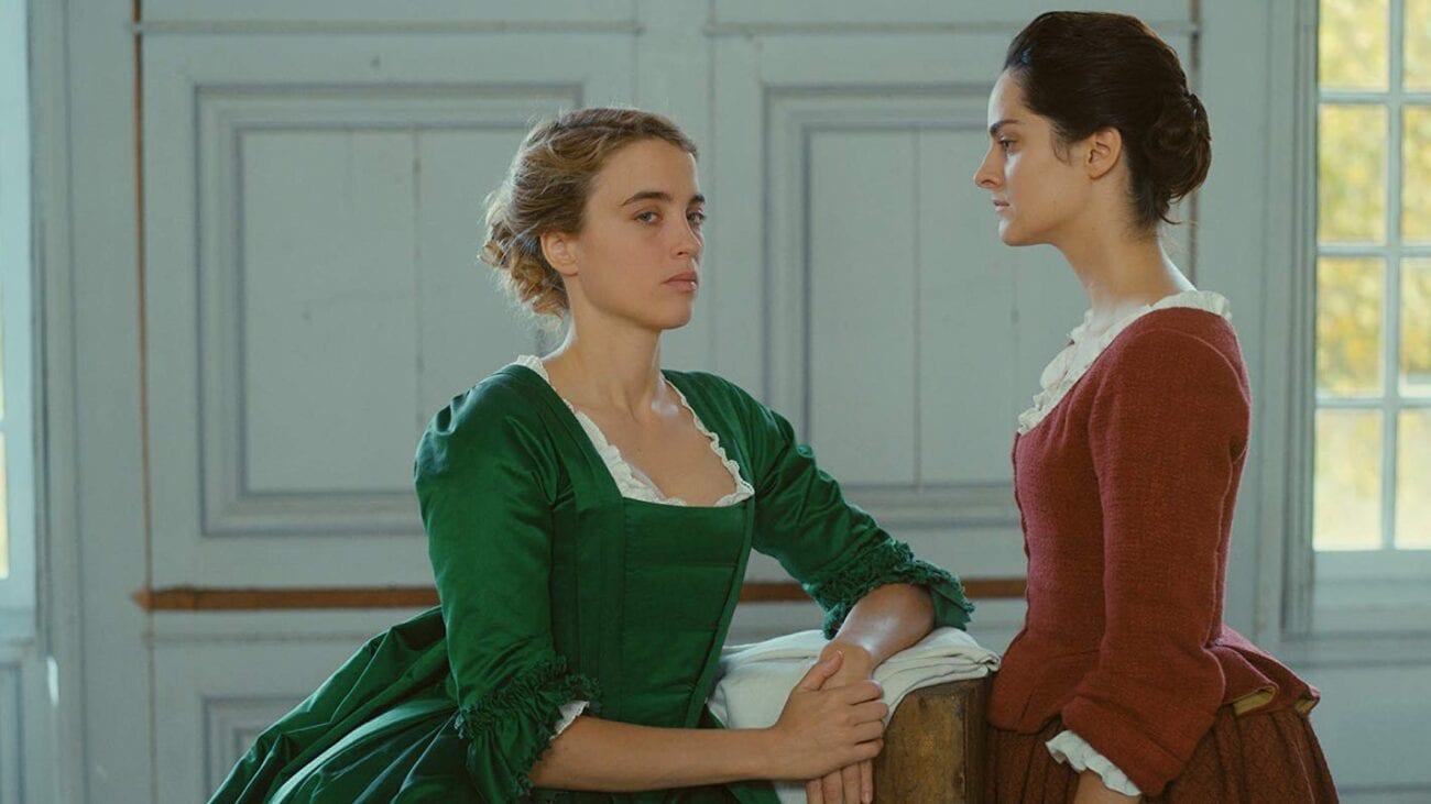 Héloise (Adele Haenel) eyes the camera knowingly while posing for Marianne (Noemie Merlant) in Portrait of a Lady on Fire