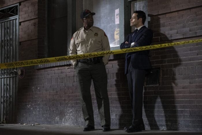 Deputy Deacon and Detective Baxter discuss the case behind caution tape.