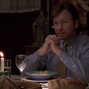 Ted says grace as he prepares to have dinner with Joyce and Buffy