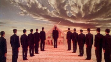 Men stand in two lines approaching a pyramid-like structure in front of a stormy sky in Mishima: A Life in Four Chapters