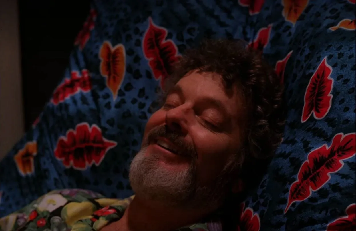 Jacoby smiles with his eyes closed as he is hypnotized