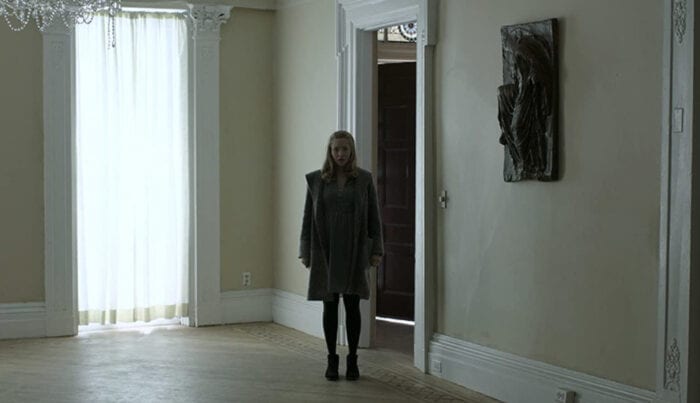 Mary stands in Toller's house after she miraculously appears.