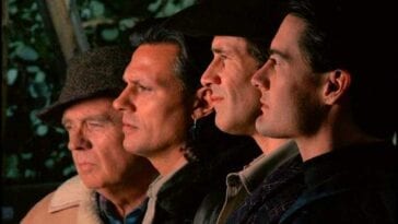 Doc Hayward, Hawk, Harry and Coop lined up in profile outside of the Log Lady's cabin