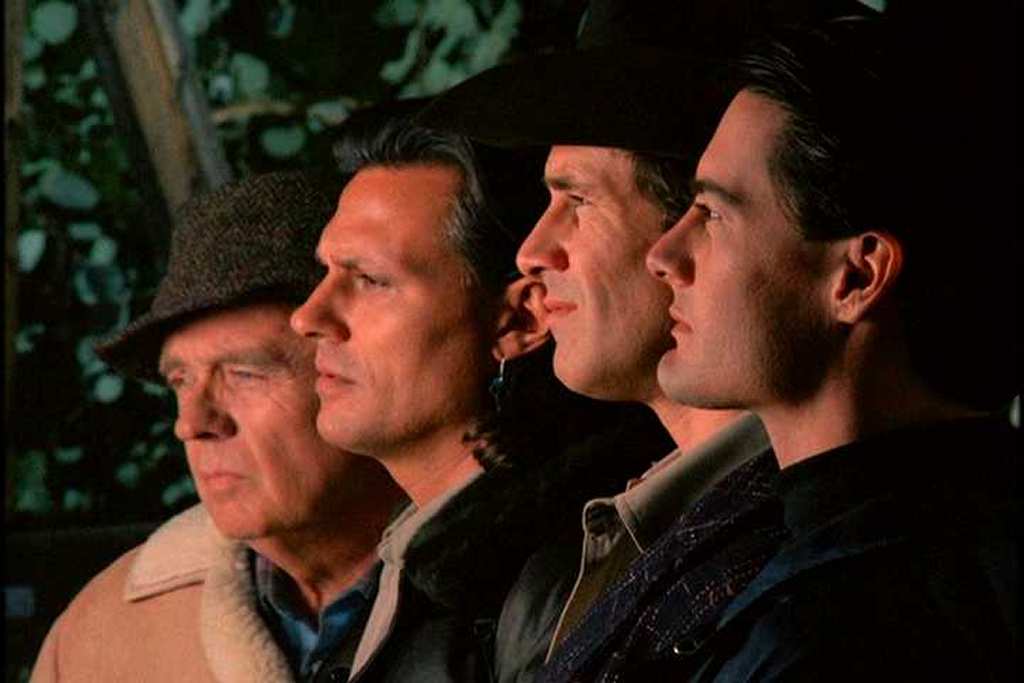 Doc Hayward, Hawk, Harry and Coop lined up in profile outside of the Log Lady's cabin