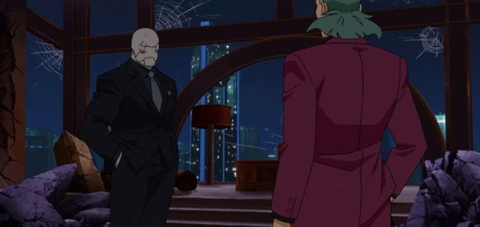 Titan stands in Machine Head's ruined penthouse with Isotope at the end of Invincible S1E5. Titan is wearing a very sharp suit.