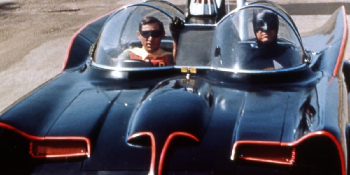 Batman and Robin riding in the Batmobile in the TV Batman of the 1960s