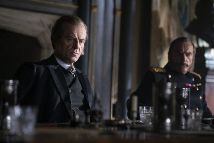 Lord Massen sits at a table looking dour in The Nevers pilot, Touched