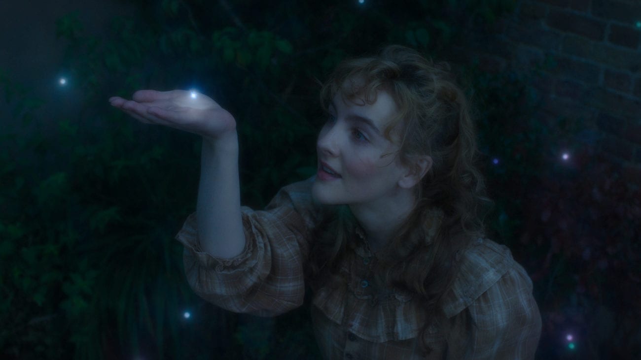 Penance Adair (Ann Skelly) reaches up a hand to be touched by a glowing speck in The Nevers