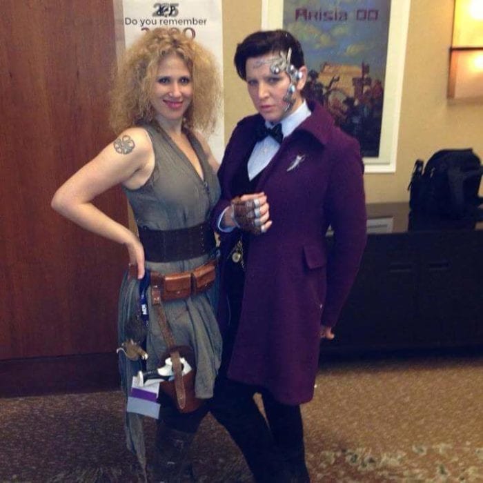 Lee as Mr. Clever and Cat as River Song posing for a photo at a convention