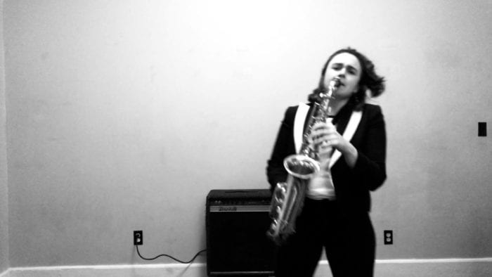 Anna Meadors of Joy on Fire playing saxophone.