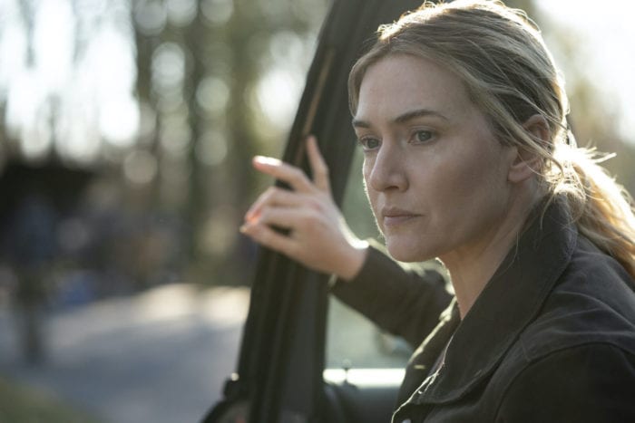 Mare (Kate Winslet) exits a car.
