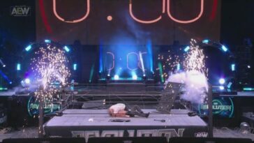 Eddie Kingston lies on top of Jon Moxley as the explosives go off at AEW Revolution.