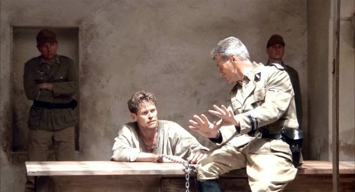 Willem Dafoe plays Caravaggio, who in this image is being shackled, held prisoner, and tortured by Nazi interrogators in The English Patient (1996)