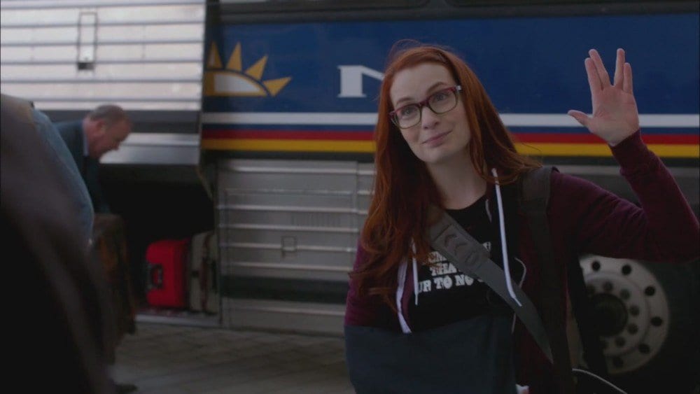 Charlie Bradbury with one arm in a sling, the other doing the Vulcan salute