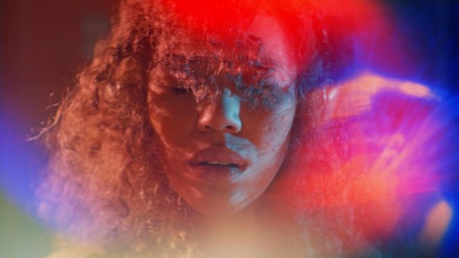 After hearing a violent, powerful sound, Alexis (Jasmin Savoy Brown) has a colorful, euphoric synesthetic moment.