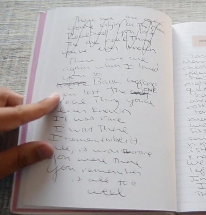 A photograph of Taylor Swift's journal, showing the original lyrics