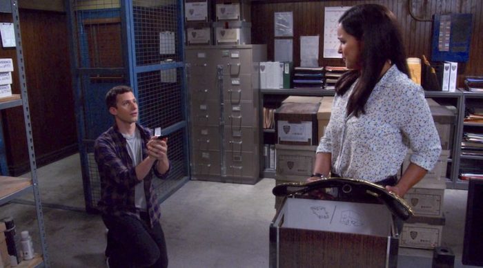 Jake proposing to Amy in the evidence room