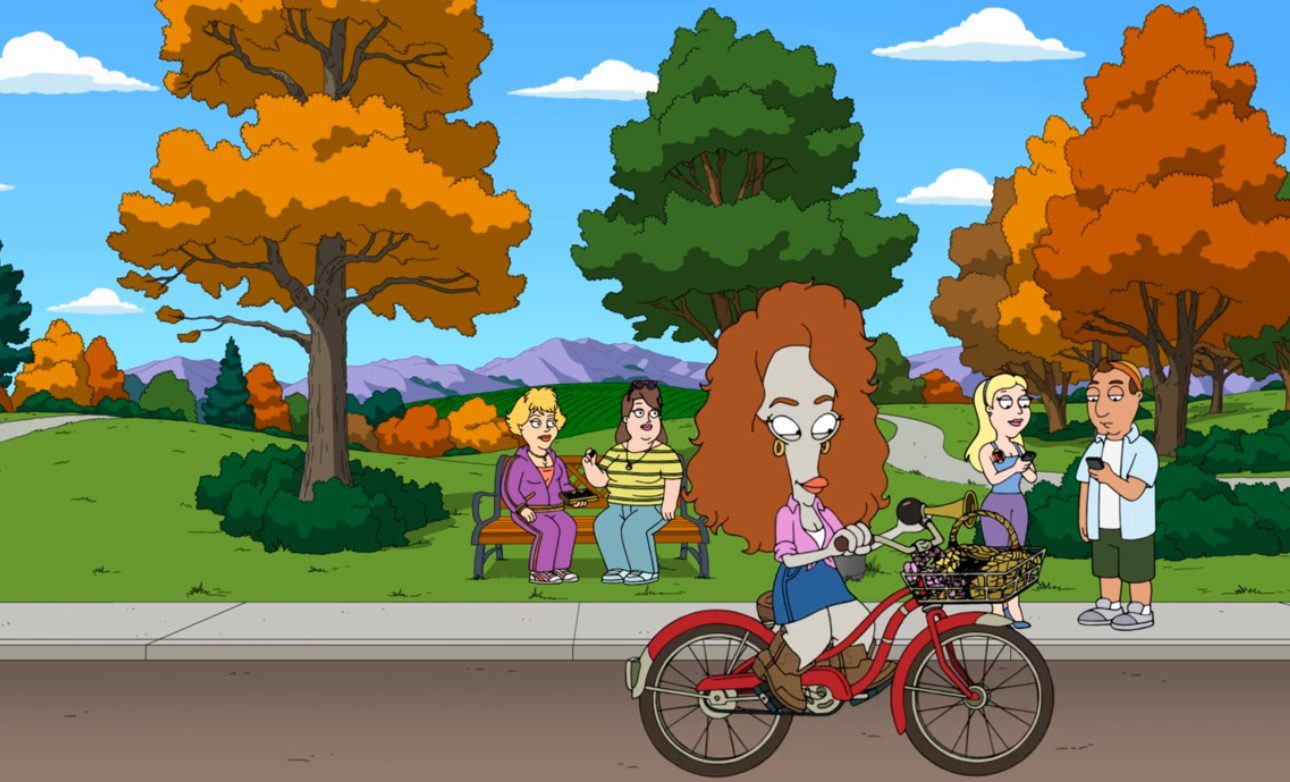 A bulbous-headed grey alien in a large wig rides a bycicle past a tree-filled park people with several onlookers (Roger as Julia Rogerts in American Dad!)