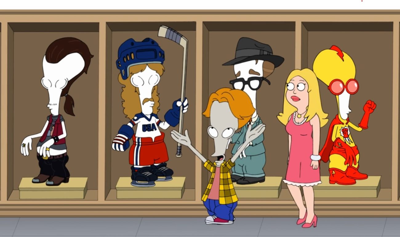 A bulbous-headed grey alien and a blonde woman in a pink dress walk past several manniquins wearing different outfits (Roger Smith and Francine Smith in American Dad!)