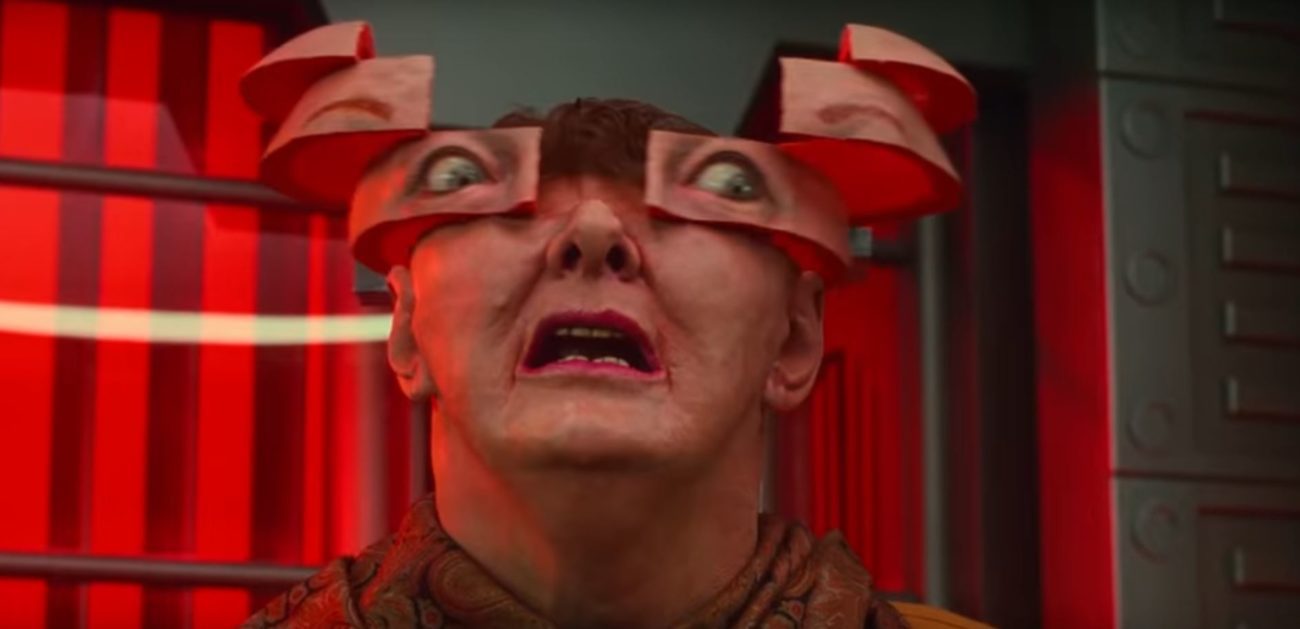 A face splits into strips from the top down in Total Recall